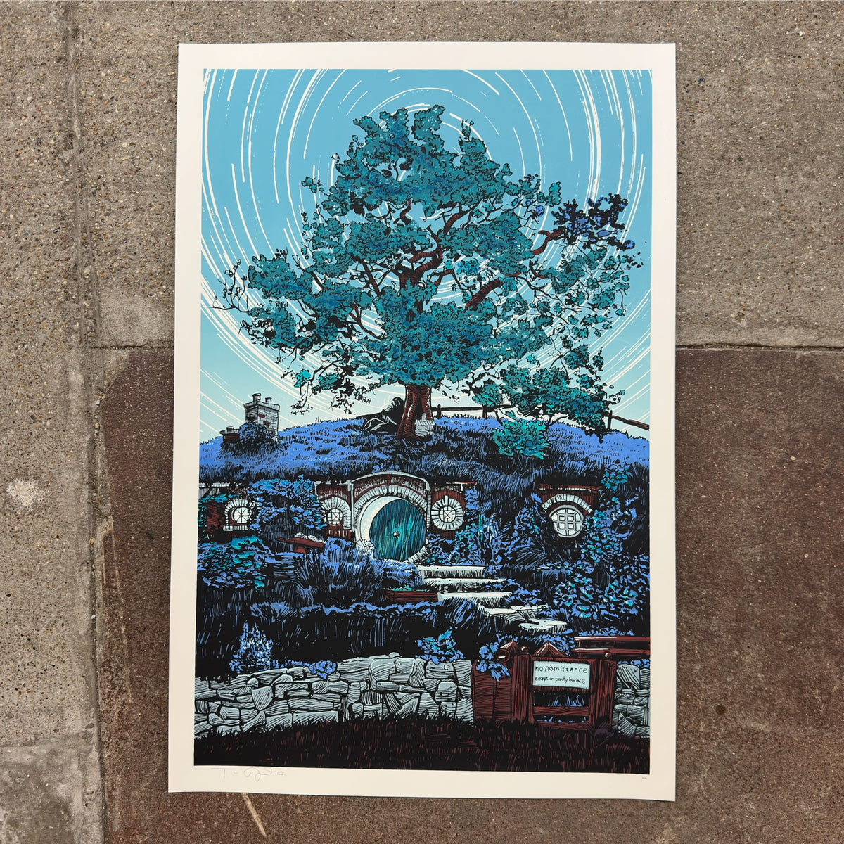 Concerning Hobbits screenprint by Tim Doyle laid on a concrete floor