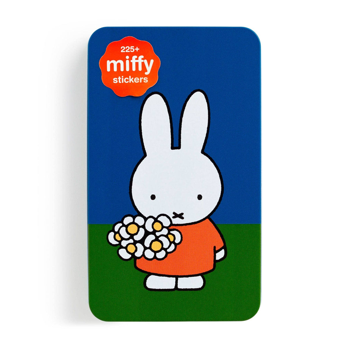 Front of the Miffy sticker tin, Miffy in an orange dress holding white daisies against blue sky and green grass