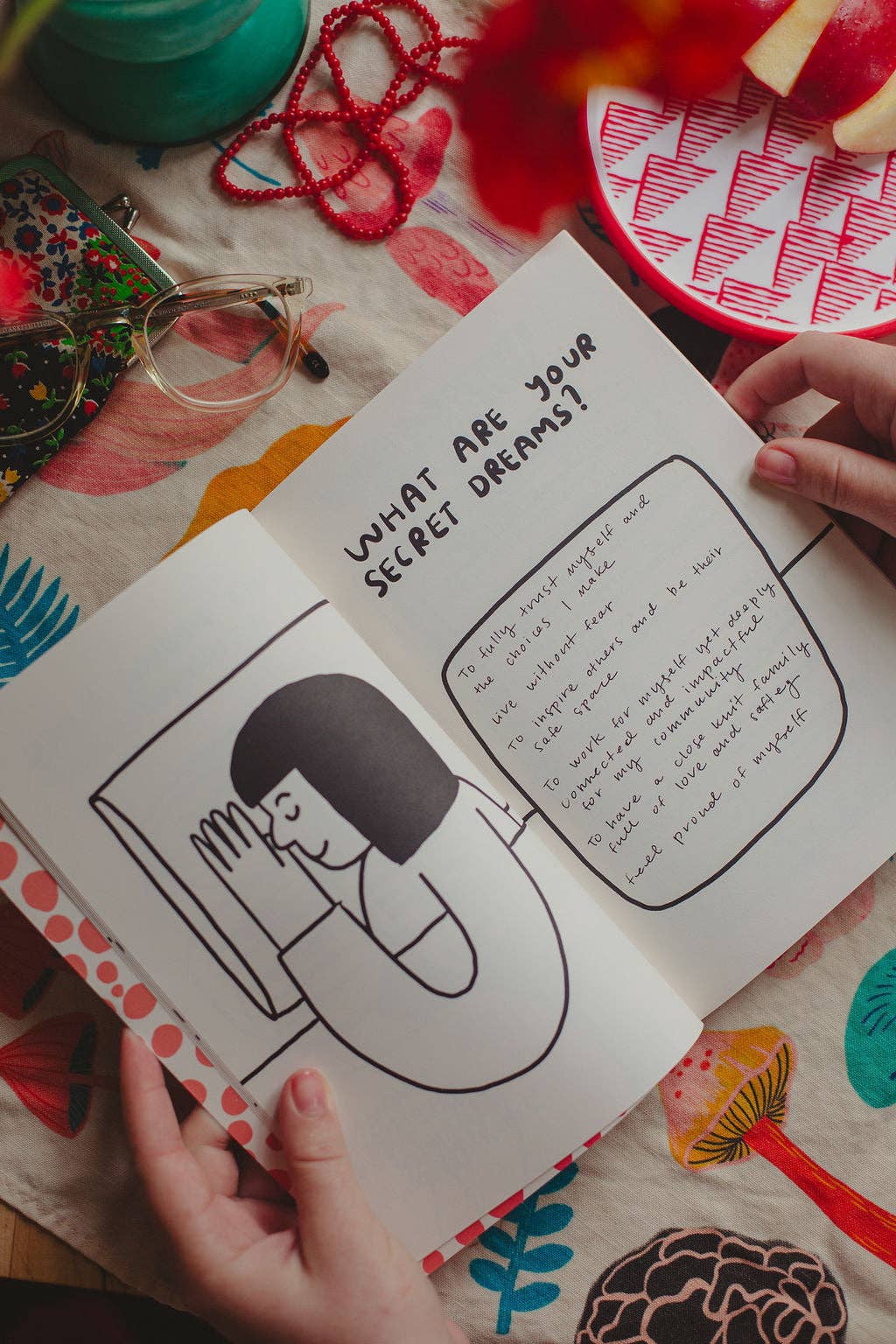 Make It Happen journal open to a self-reflection prompt page