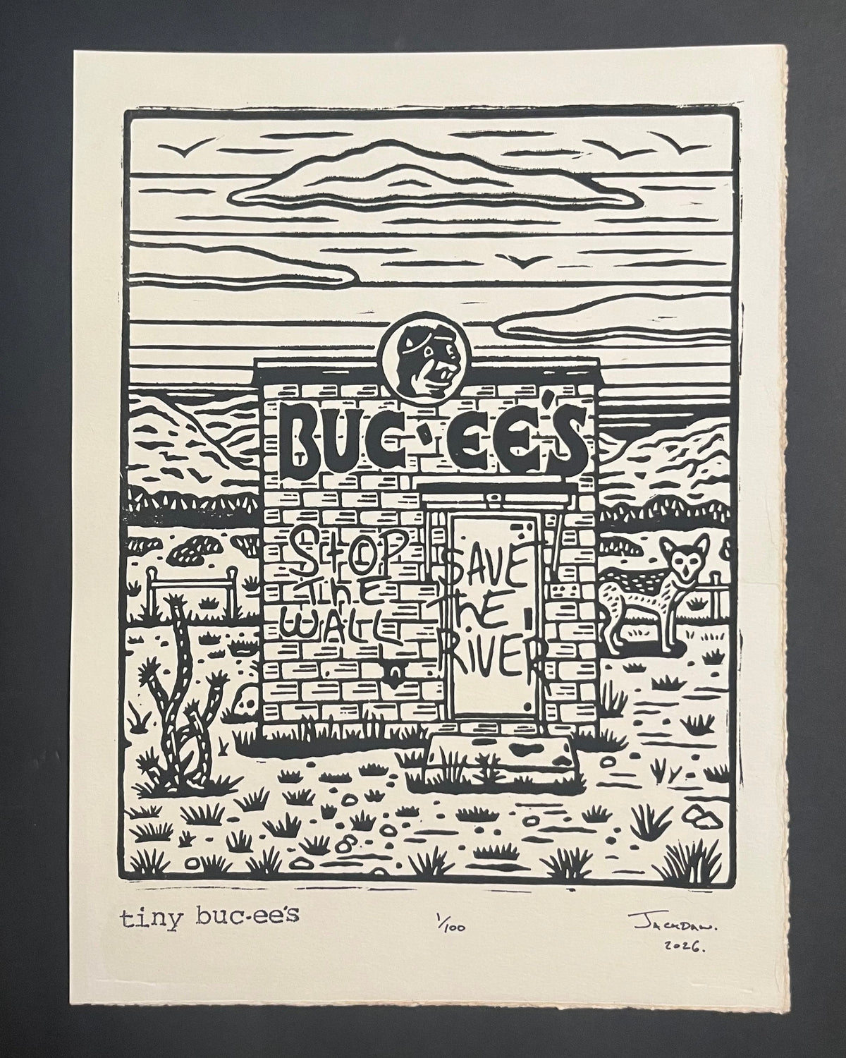 Tiny Buc-cee's linocut print by Jack Russell (Jackdaw Folk Art): a tiny Buc-ee's in the desert