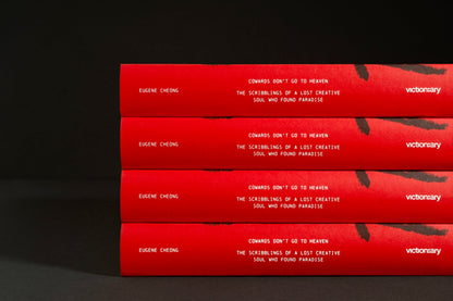 Stacked spines of Cowards Don't Go to Heaven showing the Victionary logo