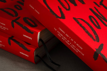 Close-up of stacked copies of Cowards Don't Go to Heaven