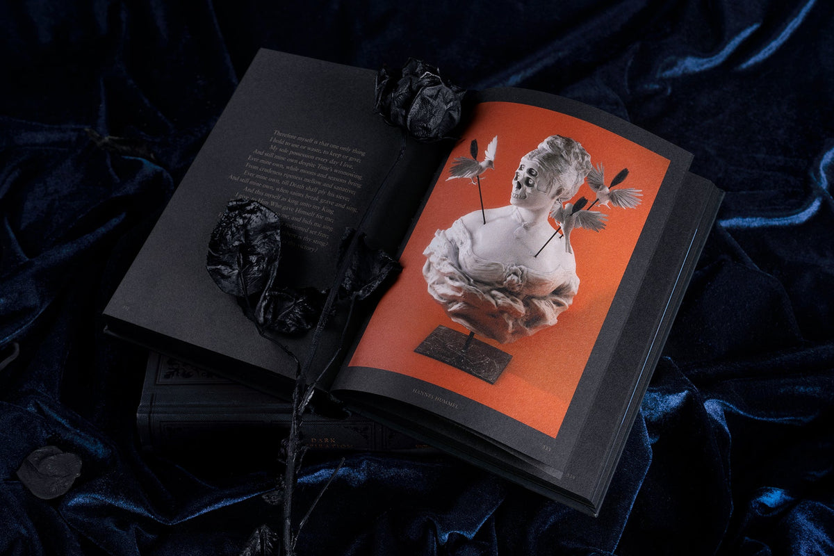 Dark Inspiration open to an inside spread with a surreal illustrated sculpture