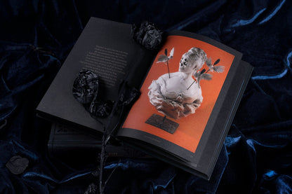 Dark Inspiration open to an inside spread with a surreal illustrated sculpture