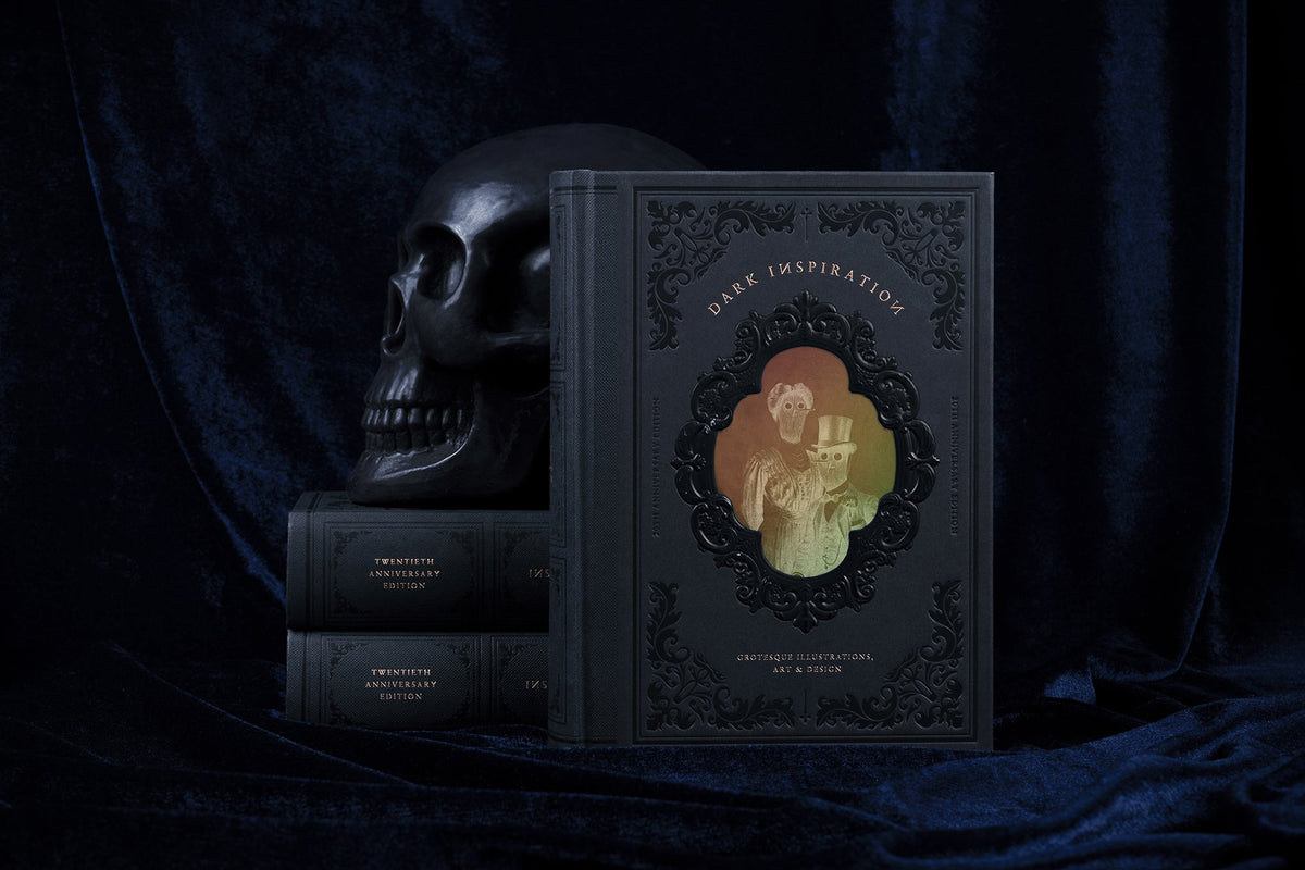 Dark Inspiration standing beside a stack of copies and a black skull