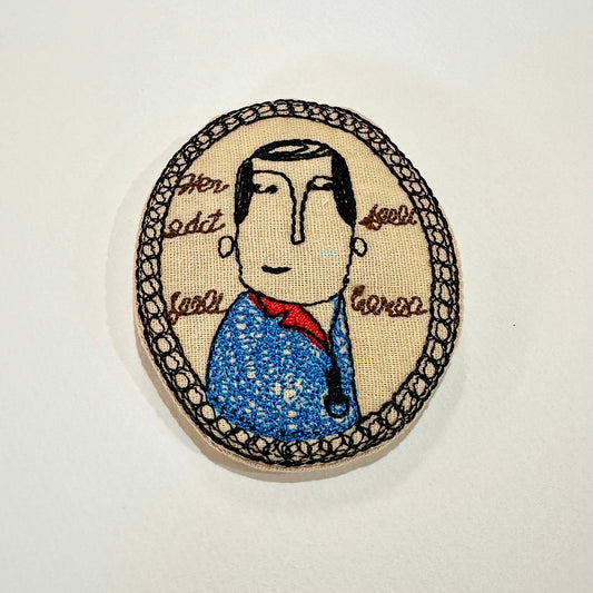 Smirking Man Embroidered Brooch (Japan)