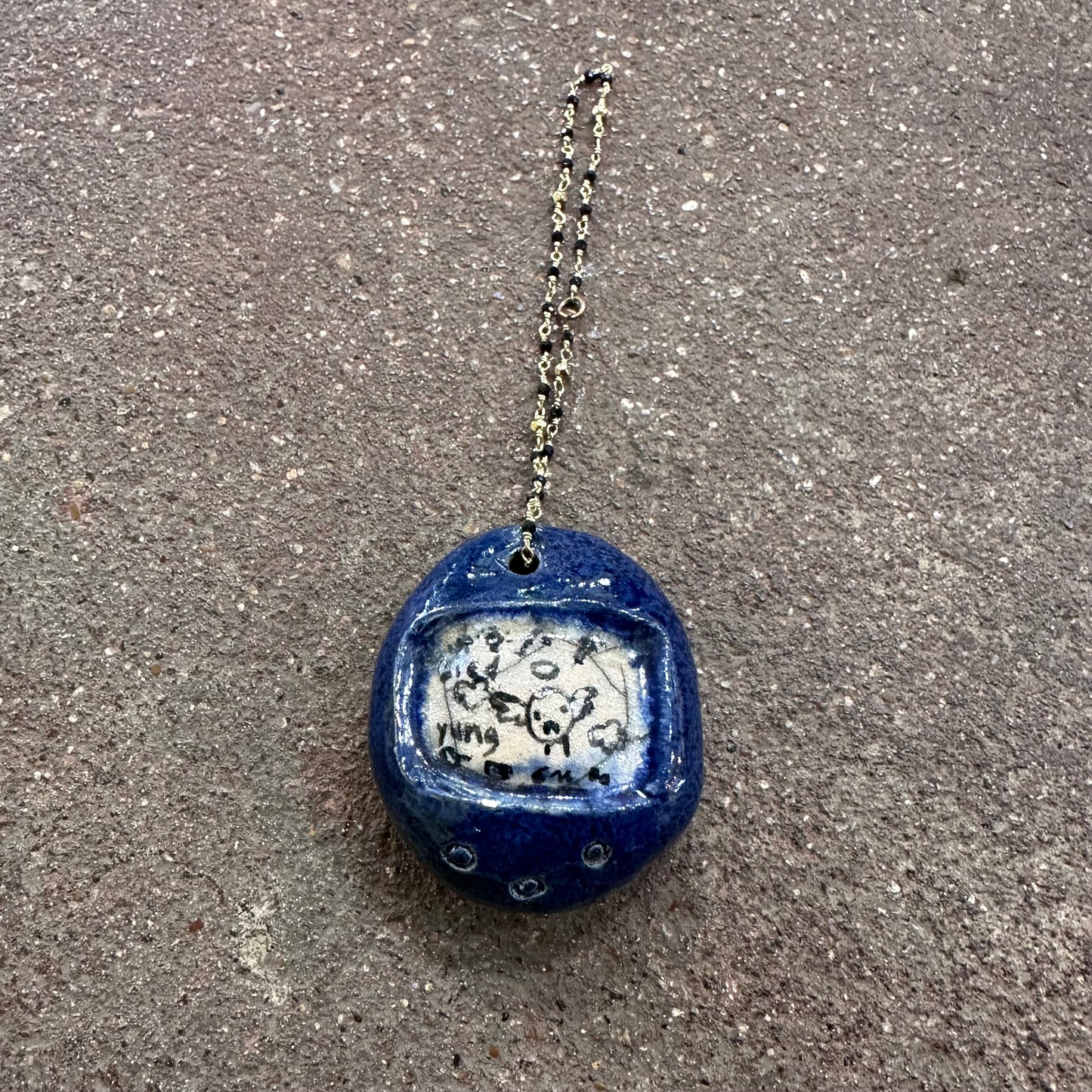 Handmade Ceramic Tamagotchi Pendants | Mylan Nguyen (TX)