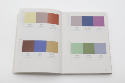 Open spread of A Dictionary of Color Combinations with four three-color palettes in yellow, mauve, rust, lilac and sage