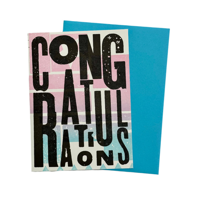Greeting card with 'Congratulations' text on a blue envelope against a gray background