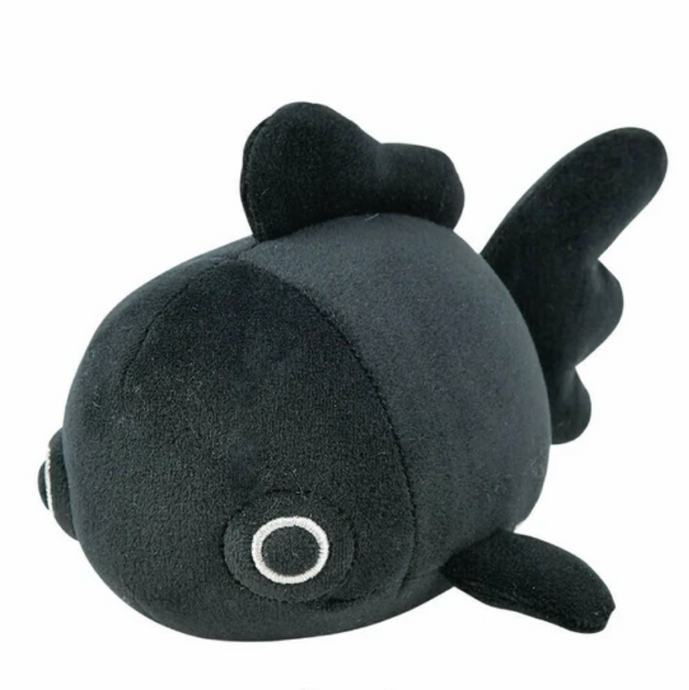 Black plush toy resembling a fish on a white background