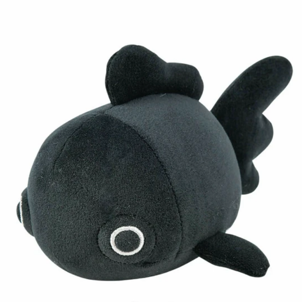 Black plush toy resembling a fish on a white background