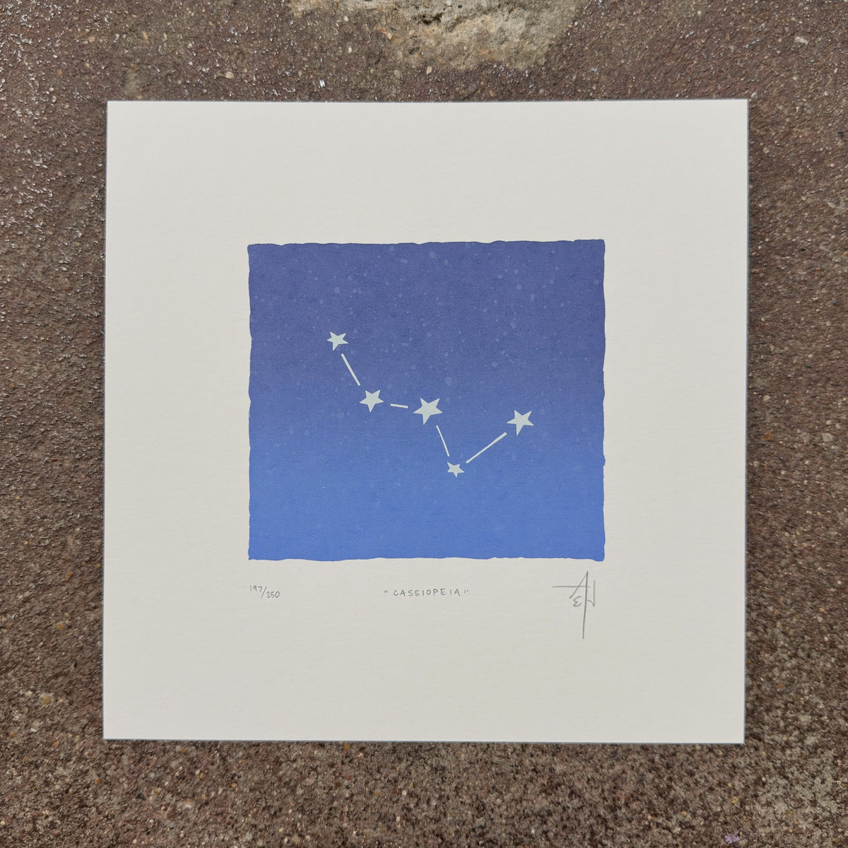 Cassiopeia constellation art print by Allison & Jonathan Metzger on a speckled stone surface at We Are 1976 in Dallas