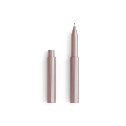 The Wren refillable writing pen in Blush with the cap removed