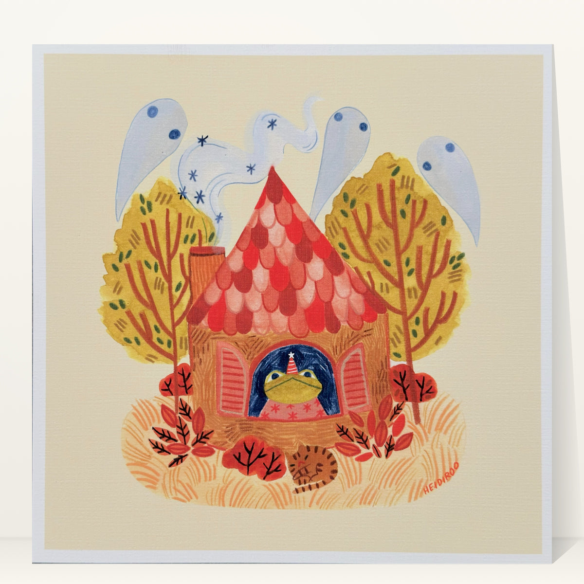 Toad in a party hat looking out the window of a red-roofed cottage with ghosts in the chimney smoke, autumn trees and a sleeping cat, art print by Heidi Moreno