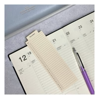 Laconic Style Bookmarker marking a page in a weekly planner