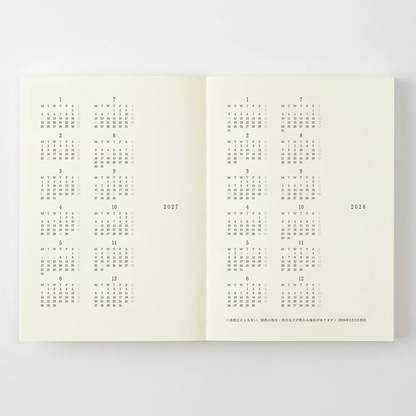 Midori MD Notebook Diary 2027 opened to the 2027 and 2028 yearly calendars