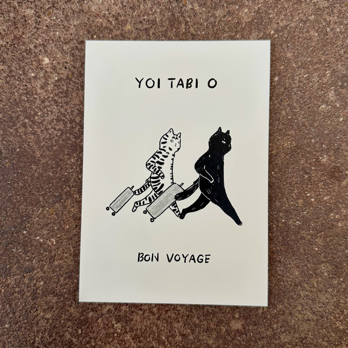 Bon Voyage mini art print by Linnan Ye photographed on a speckled stone surface