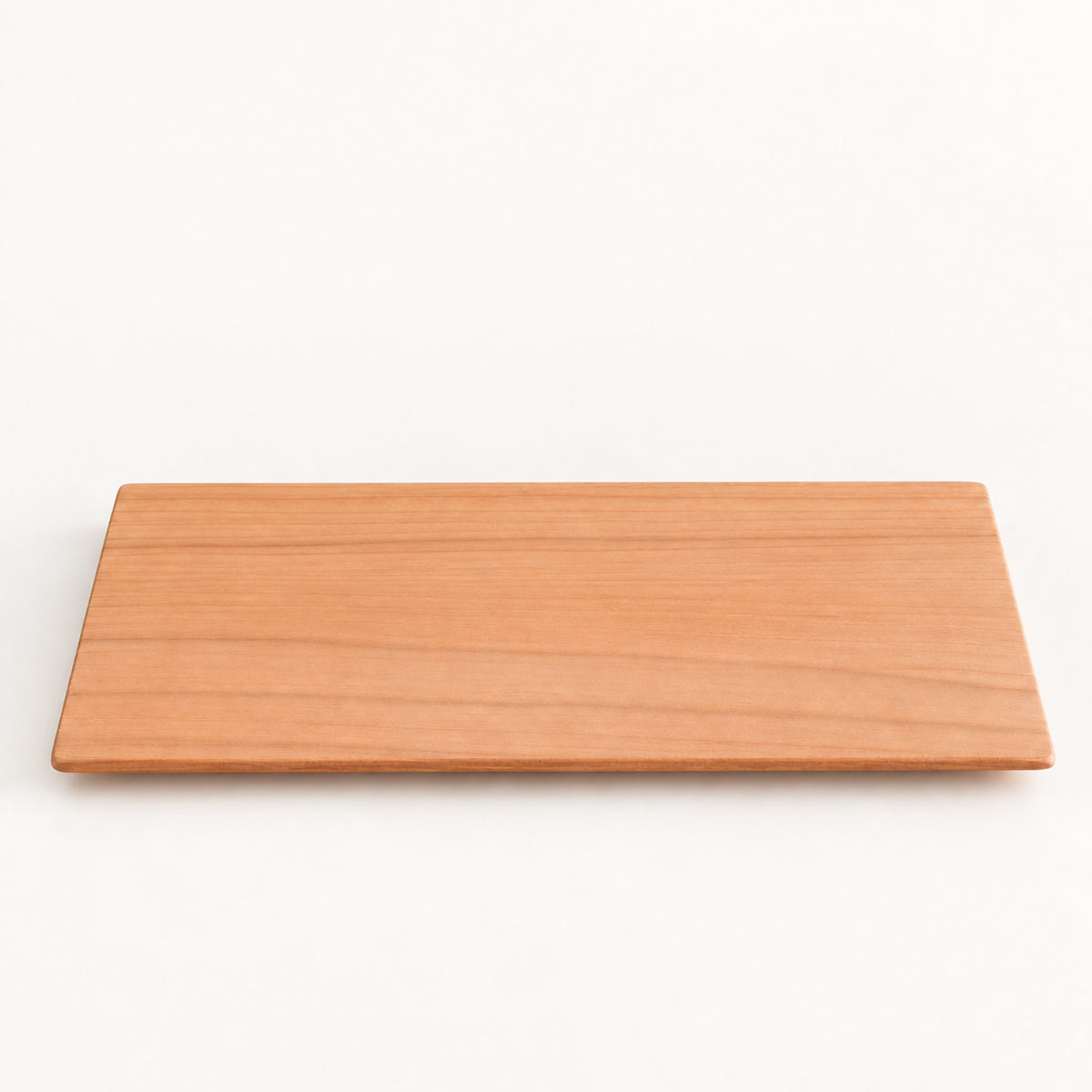 Yamazakura Long Coaster by SALIU, a slim rectangle of cherry wood