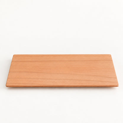 Yamazakura Long Coaster by SALIU, a slim rectangle of cherry wood