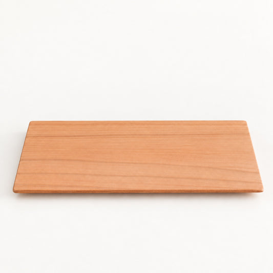 Yamazakura Long Coaster by SALIU, a slim rectangle of cherry wood