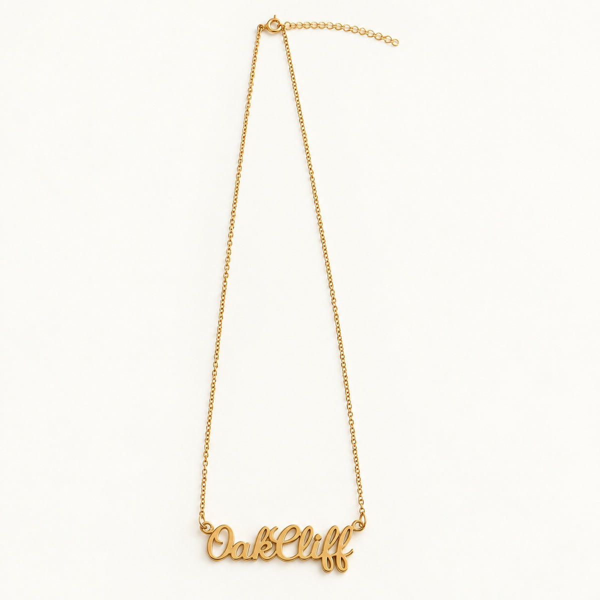 Gold Oak Cliff script name necklace on cable chain with extender