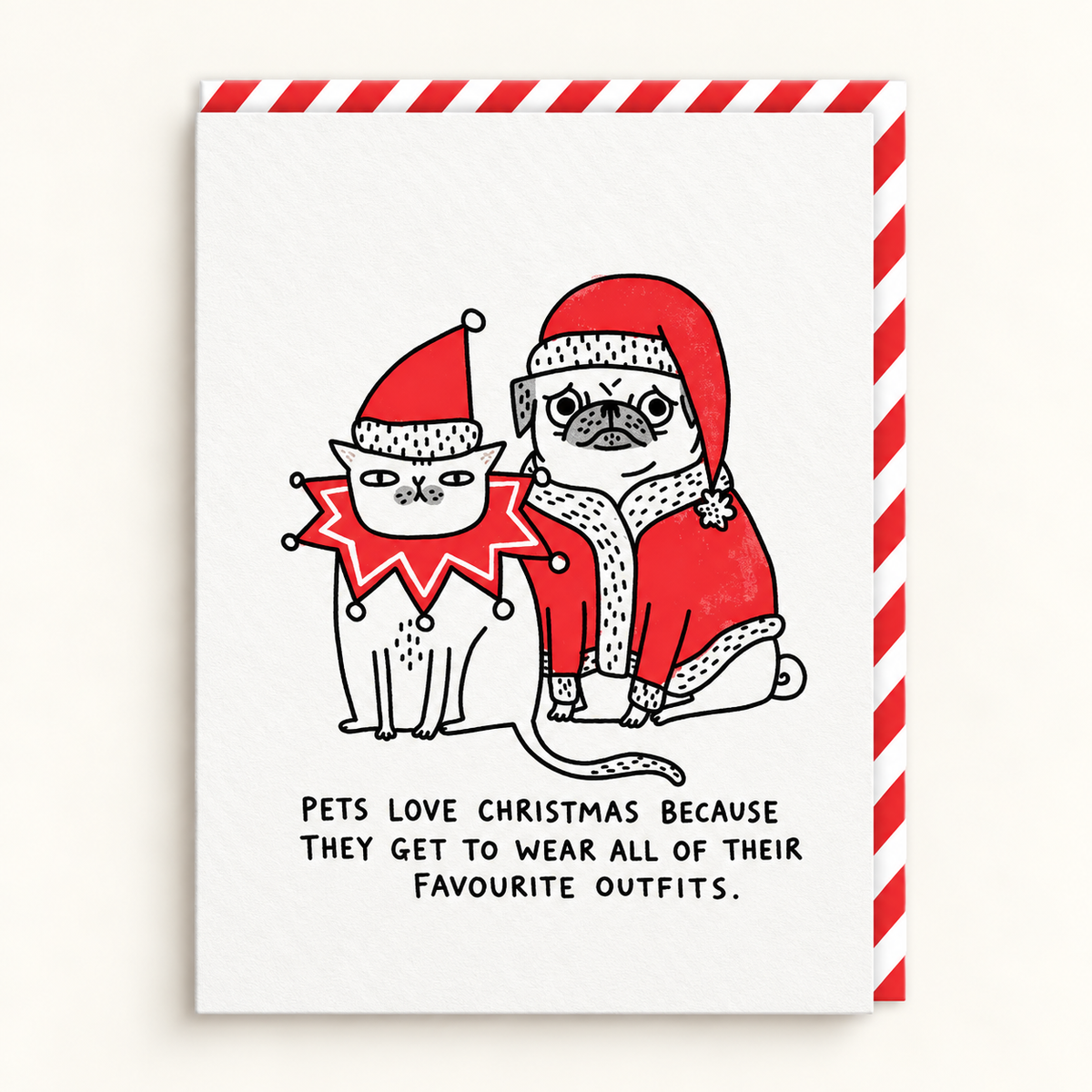 Pets Love Christmas Card by Gemma Correll: a cat in a Santa hat and a pug in a Santa suit above the line Pets love Christmas because they get to wear all of their favourite outfits, with a red and white striped envelope