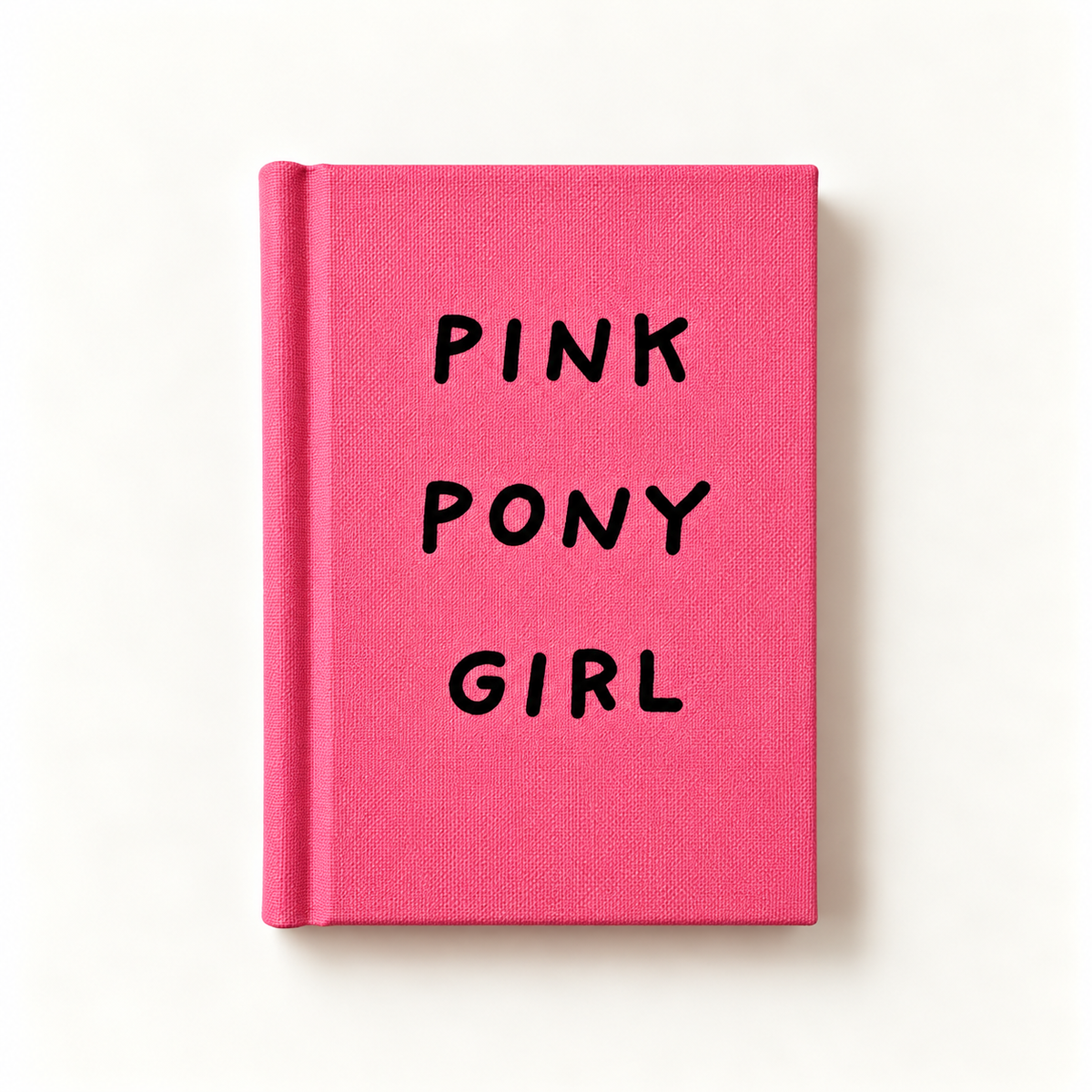 Pink Pony Girl A7 fabric hardback notebook by Ohh Deer, hot pink linen cover with hand-lettered black type, studio shot