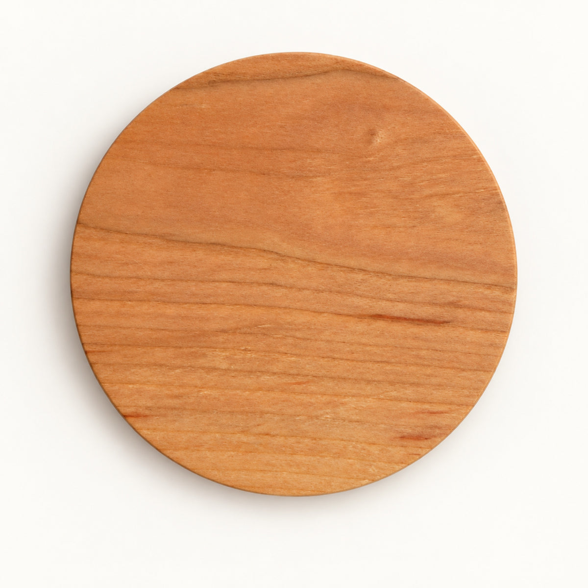 Round Yamazakura cherry wood coaster by SALIU, top view showing the wood grain