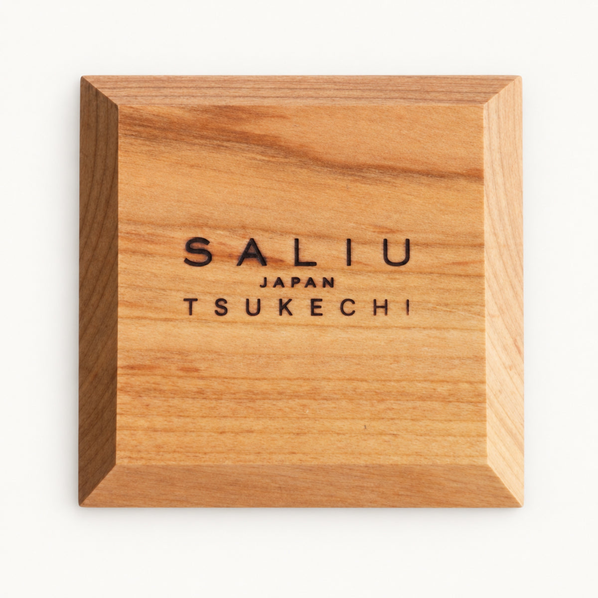 Underside of the square SALIU coaster with the SALIU Japan Tsukechi brand mark and beveled edges