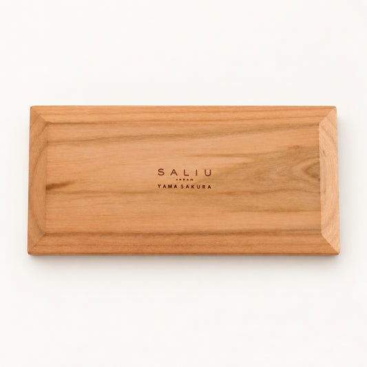 Underside of the SALIU long coaster with the SALIU Yama Sakura brand mark