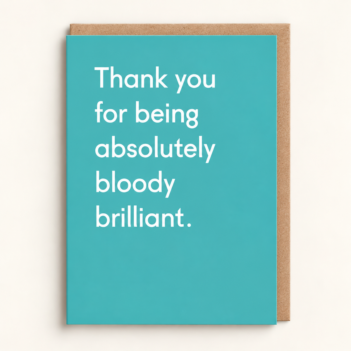 Thank You for Being Absolutely Bloody Brilliant Card by Twin Pines: white type on a turquoise card, with a brown kraft envelope behind