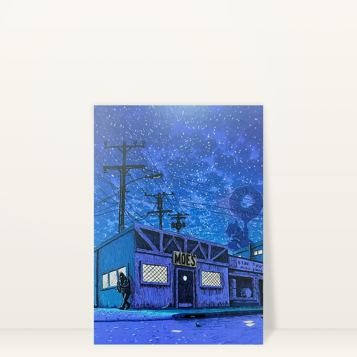 Moe's Tavern (Night) mini print postcard by Tim Doyle: Moe's Tavern at night under a starry blue sky
