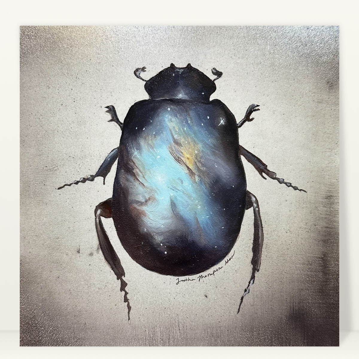 Scarab art print by Trisha Thompson Adams: a dark beetle carrying a glowing blue and gold nebula on its shell, studio photo on a light background